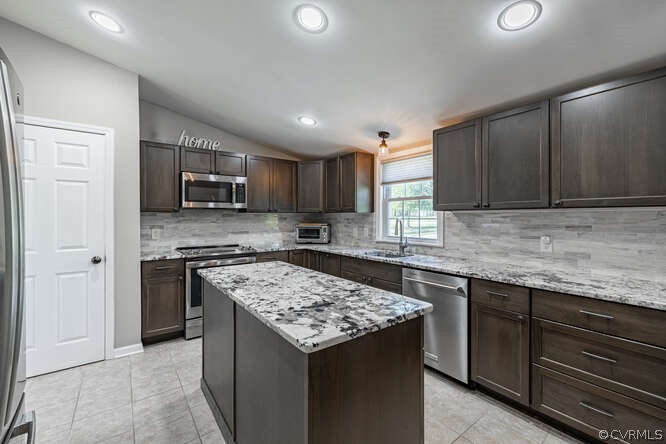 1680 Battes Road Green Bay, VA 23942 - Photo 6 of 38 a kitchen with a stove sink microwave and cabinets