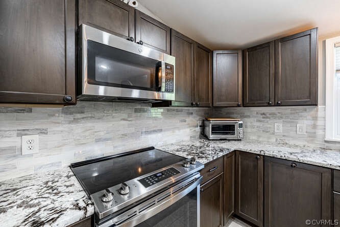 1680 Battes Road Green Bay, VA 23942 - Photo 9 of 38 a kitchen with stainless steel appliances granite countertop a stove microwave and sink