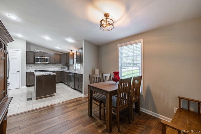 1680 Battes Road Green Bay, VA 23942 - Photo 10 of 38 a view of a dining room with furniture window and wooden floor