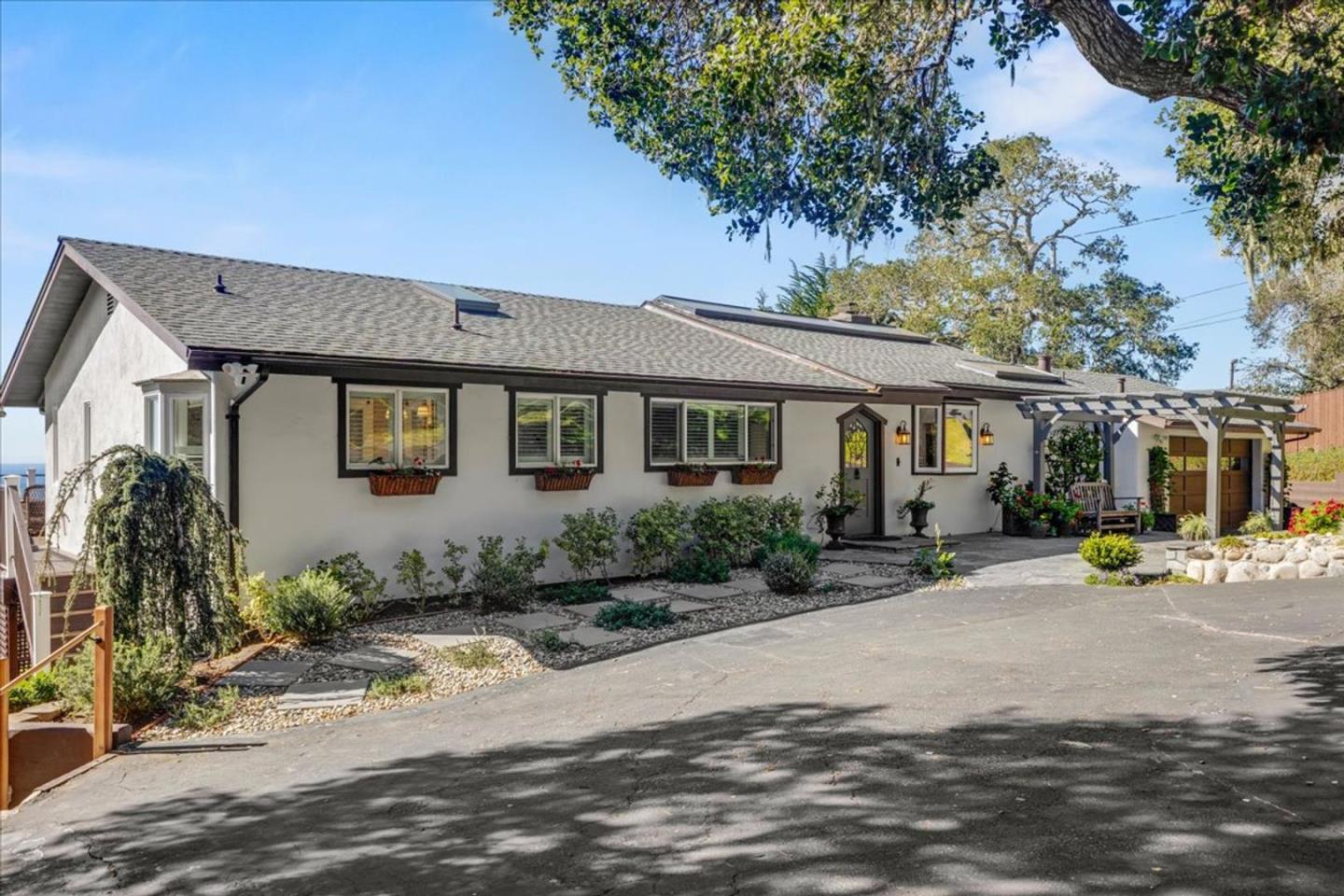 15 Mentone Road Carmel, CA 93923 - Photo 3 of 47 a front view of a house with garden