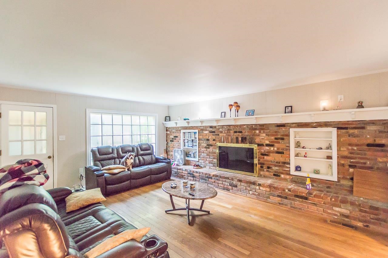 5986 Ivanhoe Road Bartlett, TN 38134 - Photo 11 of 25 a living room with furniture and a fireplace