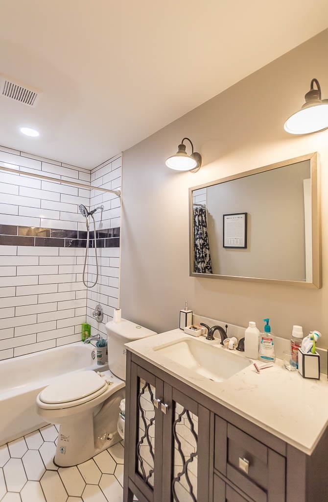 5986 Ivanhoe Road Bartlett, TN 38134 - Photo 15 of 25 a bathroom with a granite countertop sink mirror vanity and toilet
