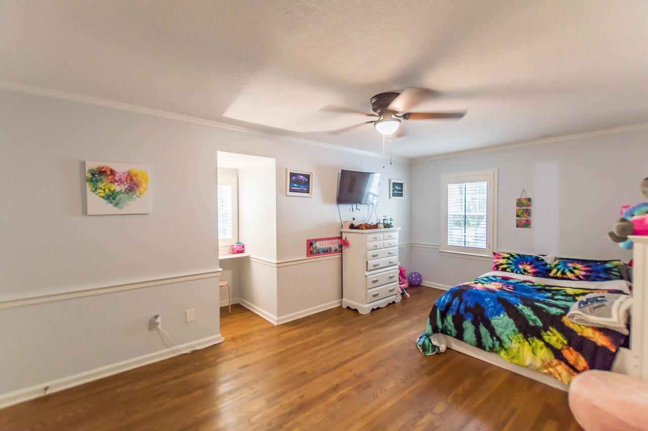 5986 Ivanhoe Road Bartlett, TN 38134 - Photo 18 of 25 a bedroom with furniture and a wooden floor