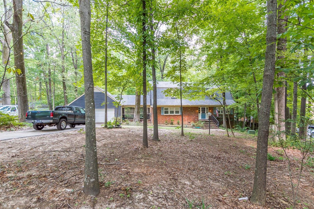 5986 Ivanhoe Road Bartlett, TN 38134 - Photo 2 of 25 a view of a house with backyard and a tree