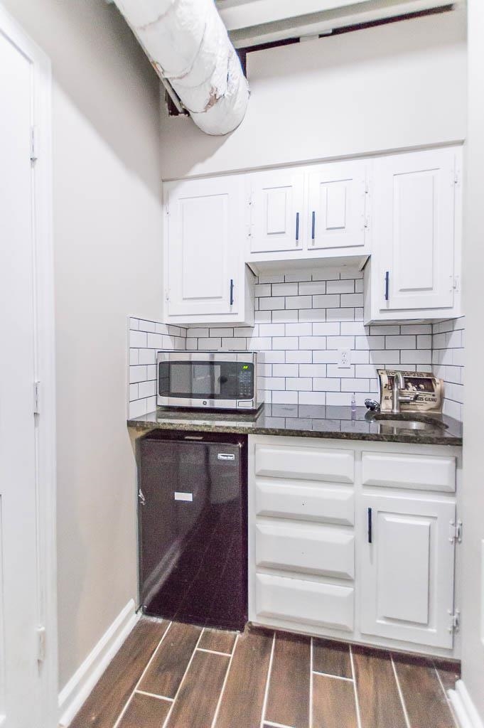 5986 Ivanhoe Road Bartlett, TN 38134 - Photo 21 of 25 a kitchen with white cabinets and appliances