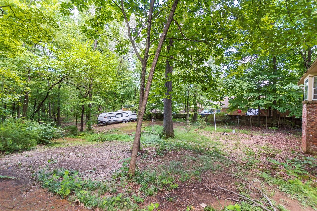 5986 Ivanhoe Road Bartlett, TN 38134 - Photo 24 of 25 a view of a lake with a house in the background