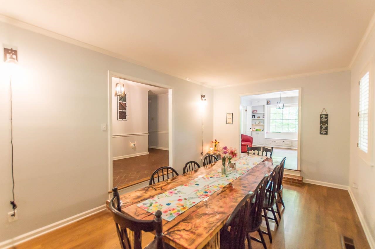 5986 Ivanhoe Road Bartlett, TN 38134 - Photo 6 of 25 a view of a a dining room with furniture window and wooden floor