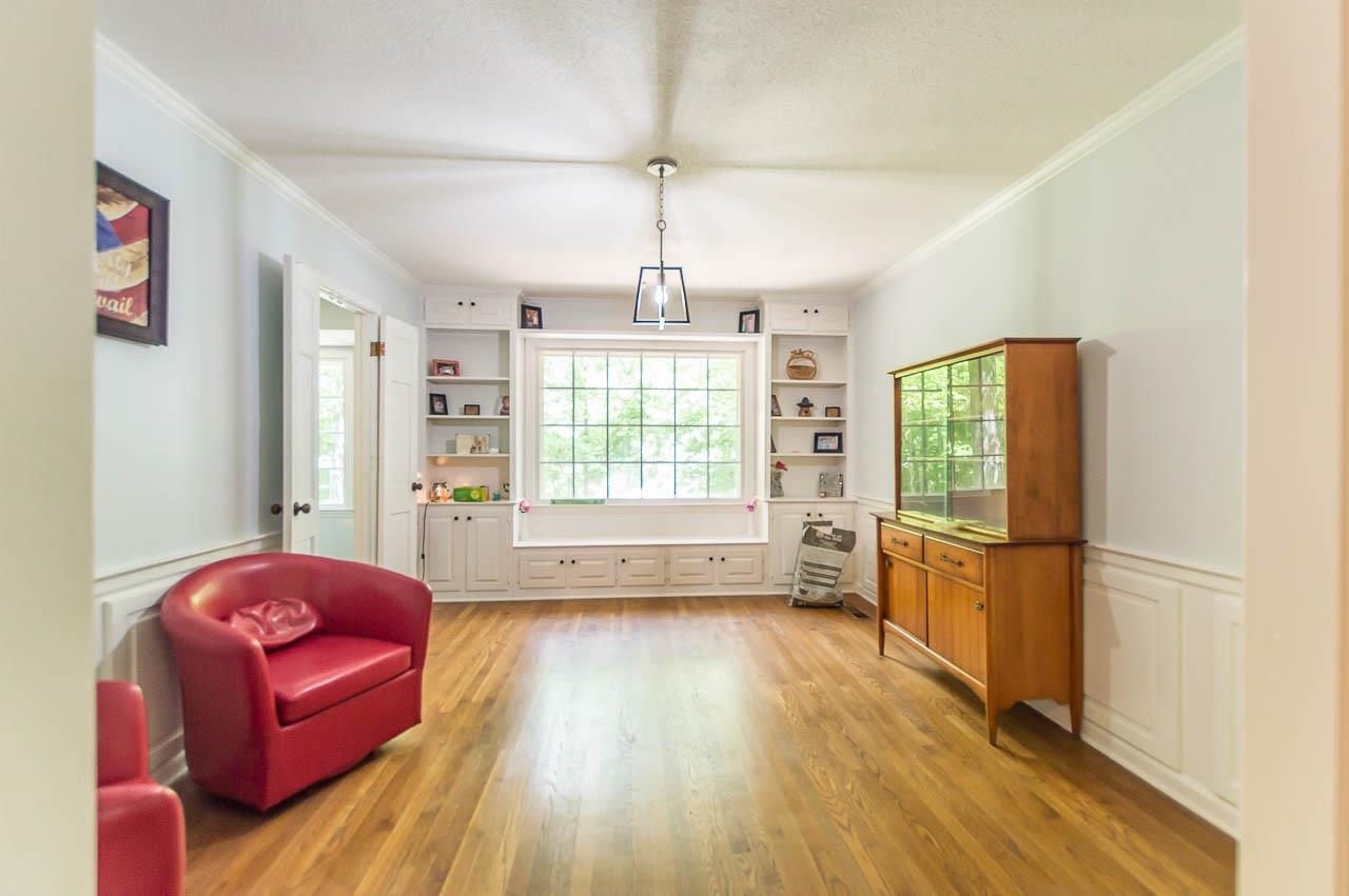 5986 Ivanhoe Road Bartlett, TN 38134 - Photo 7 of 25 a living room with furniture fireplace and wooden floor