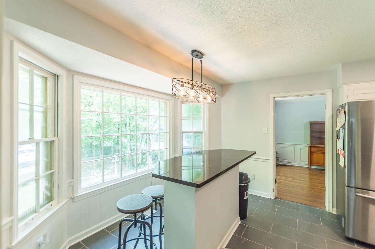 5986 Ivanhoe Road Bartlett, TN 38134 - Photo 9 of 25 a kitchen with stainless steel appliances granite countertop a refrigerator and a sink