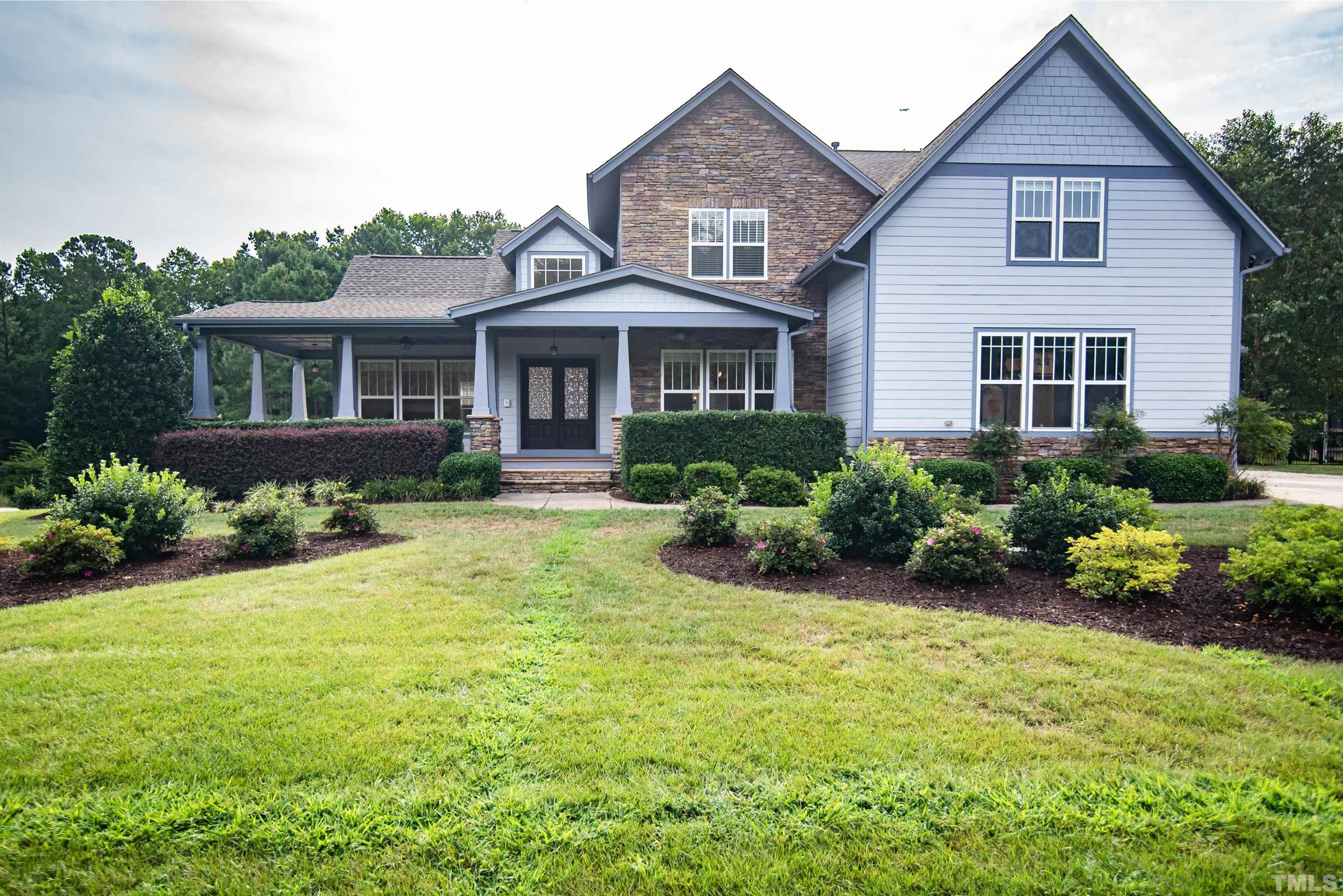 15004 Massimo Dr. Wake Forest, NC 27587 - Photo 1 of 27 a front view of a house with a yard
