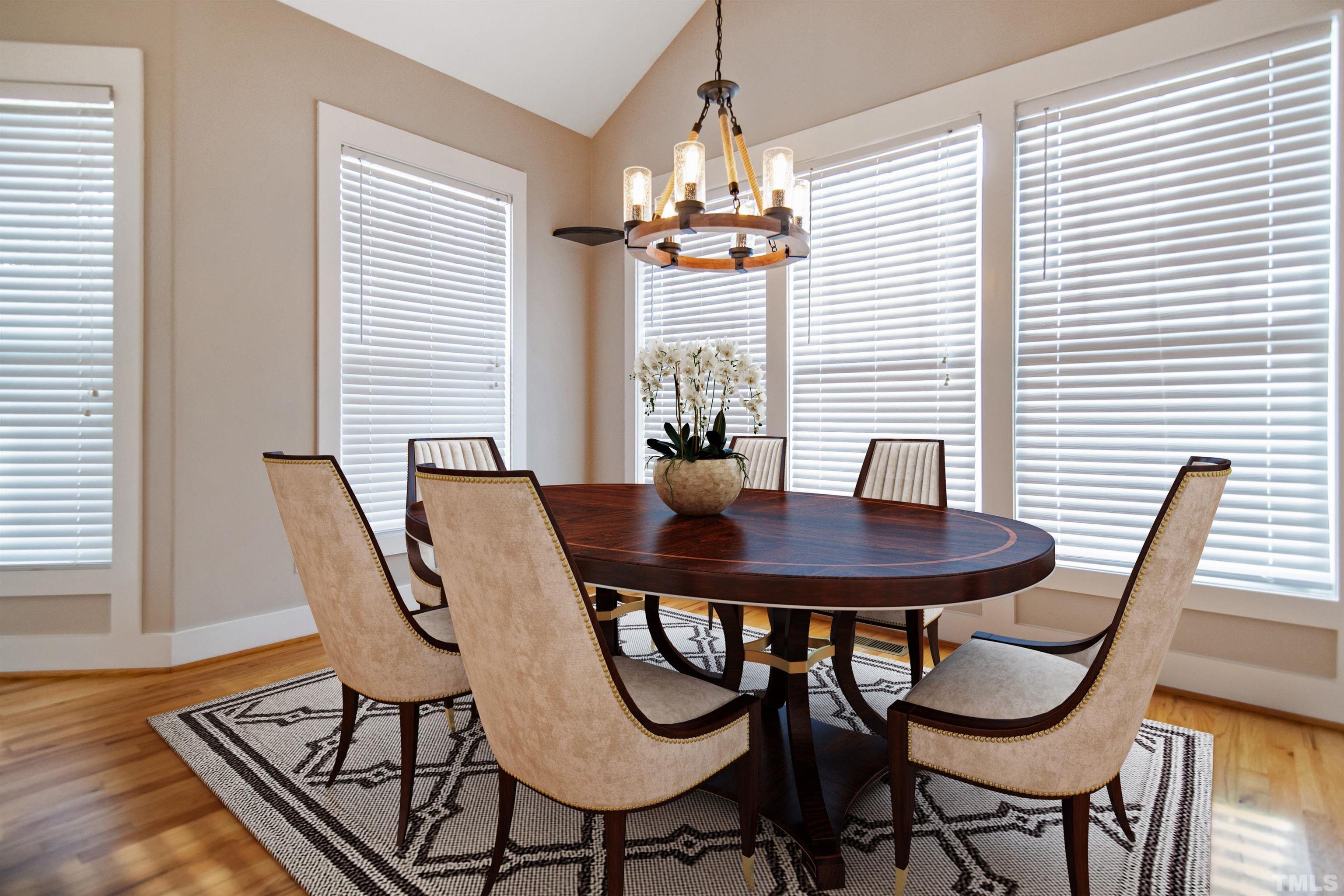 15004 Massimo Dr. Wake Forest, NC 27587 - Photo 11 of 27 a view of a dining room with furniture and window