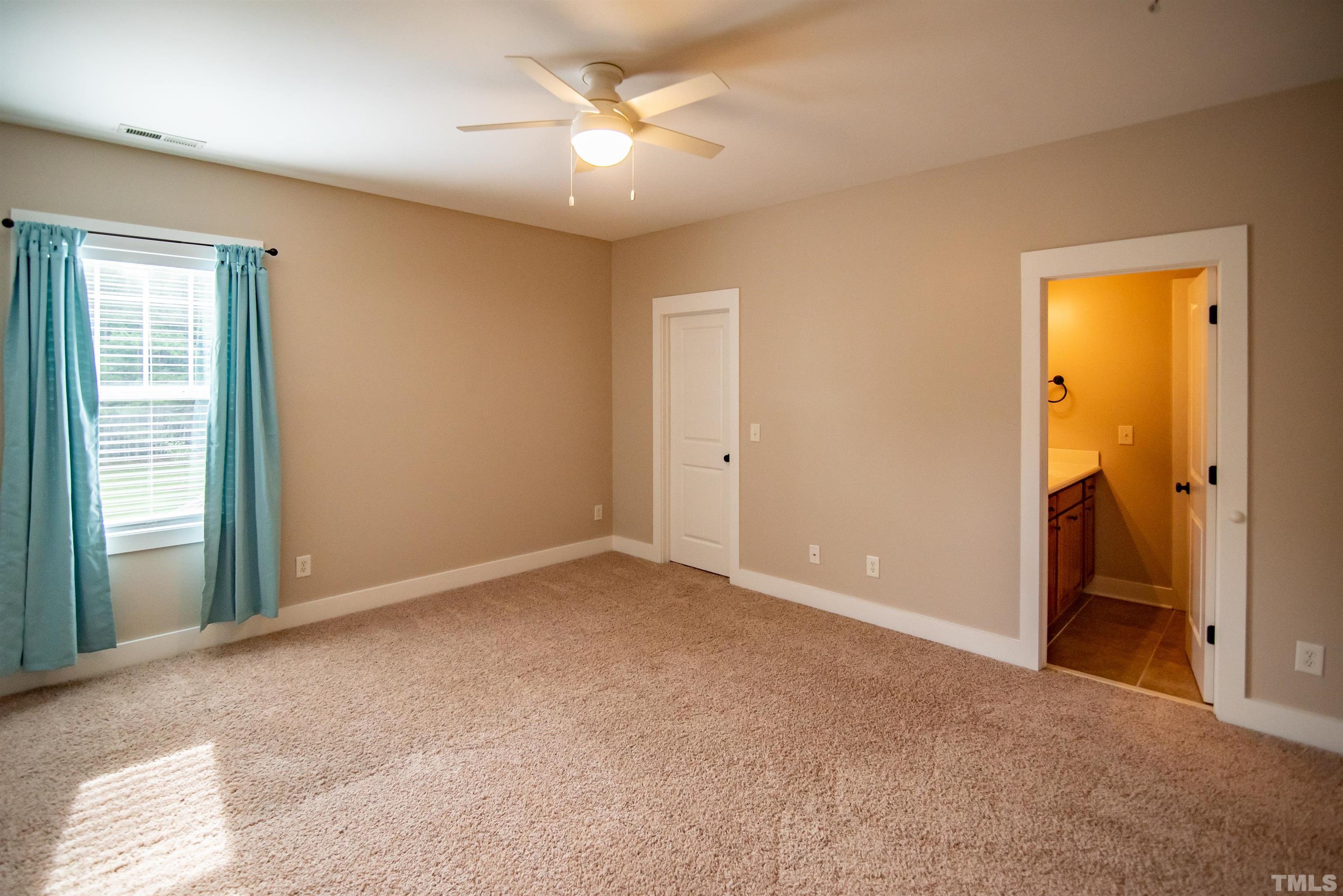 15004 Massimo Dr. Wake Forest, NC 27587 - Photo 19 of 27 a view of empty room with a ceiling fan