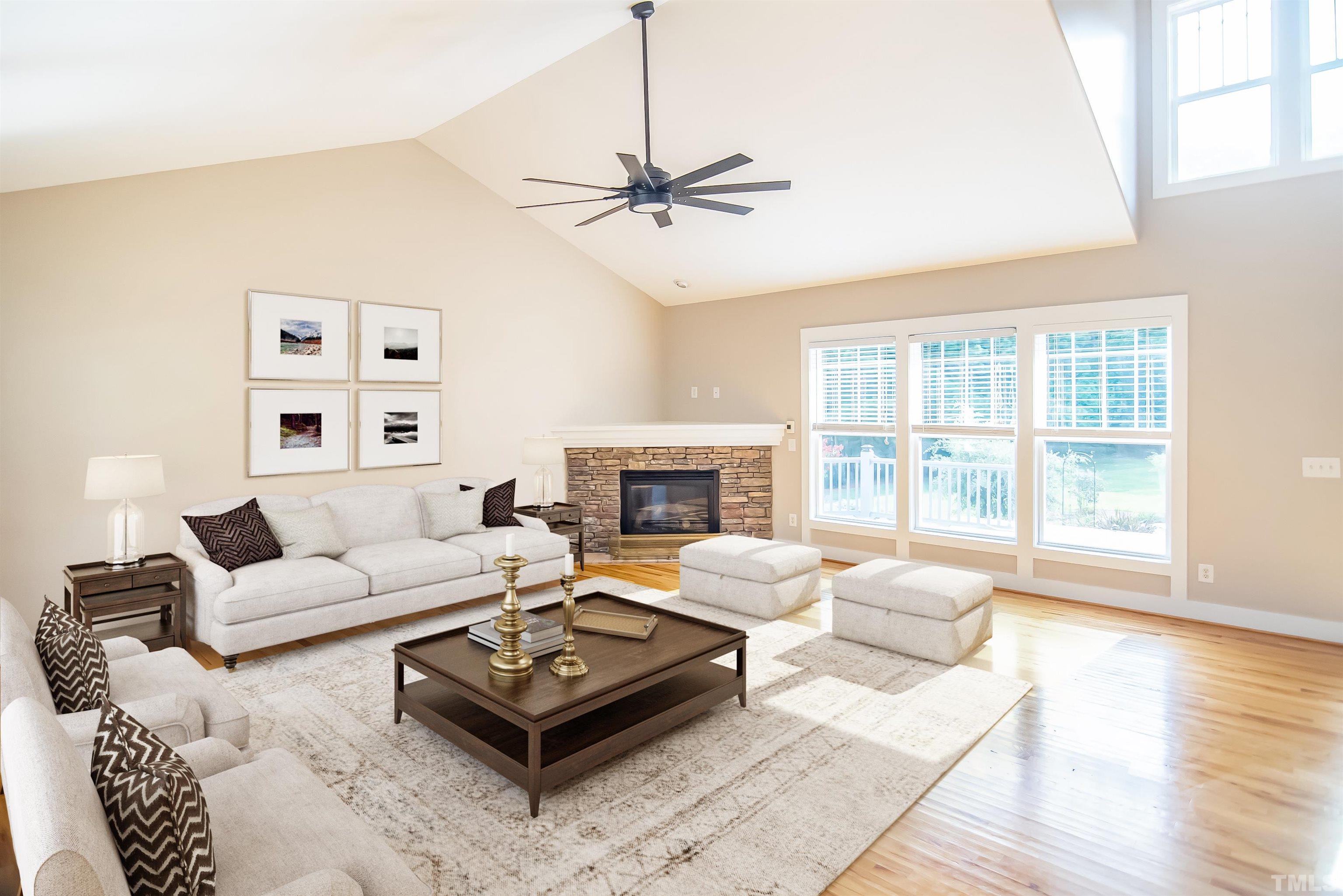 15004 Massimo Dr. Wake Forest, NC 27587 - Photo 5 of 27 a living room with furniture and a fireplace
