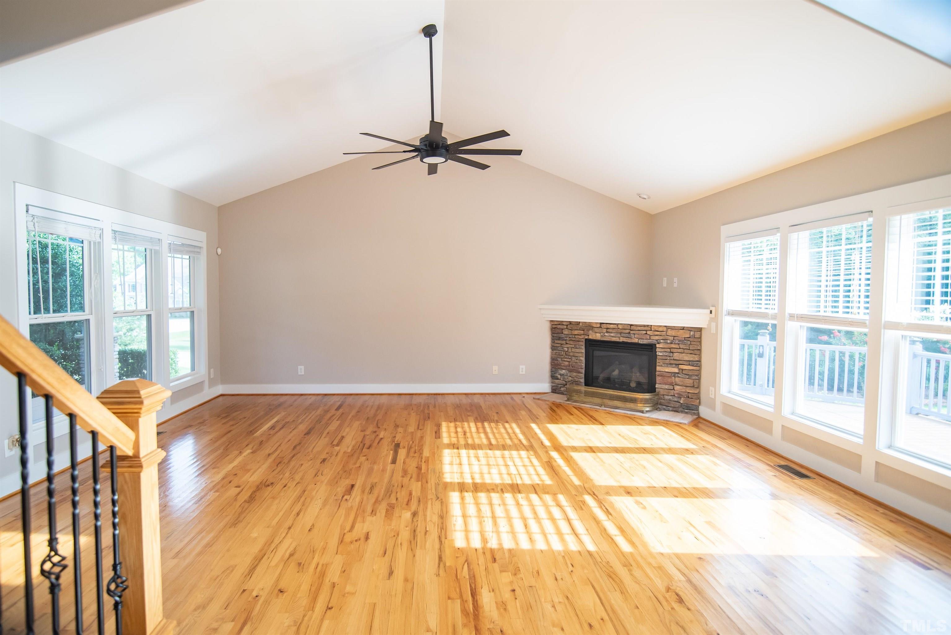 15004 Massimo Dr. Wake Forest, NC 27587 - Photo 6 of 27 a view of an empty room with a fireplace and a window