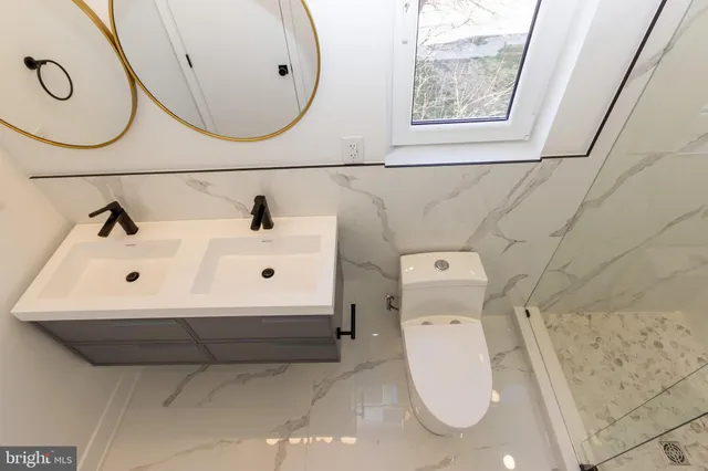 a bathroom with a sink and mirror