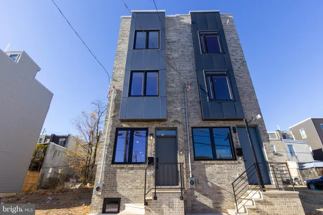 a bricked building with multiple windows