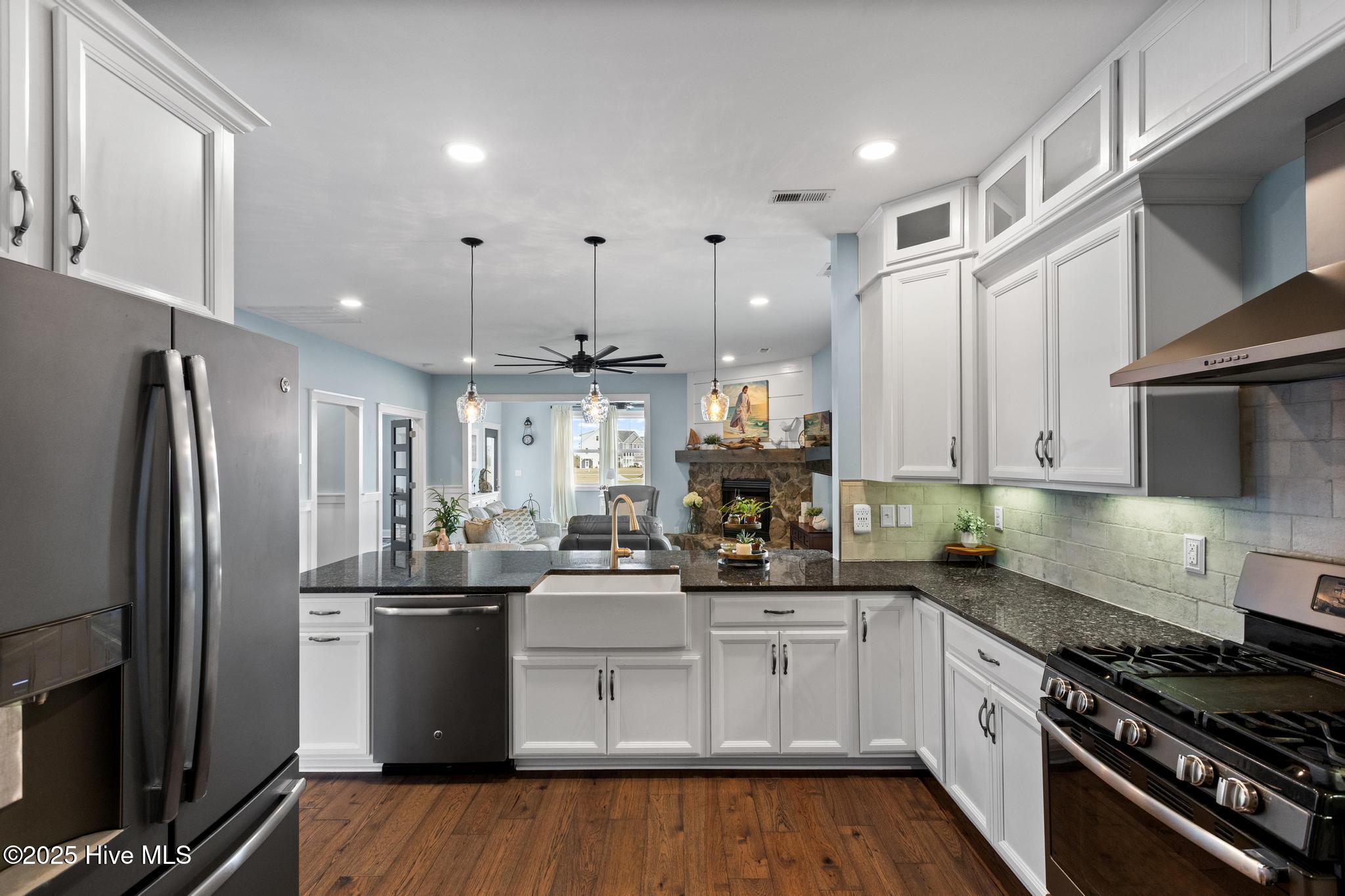 817 Sweetgrass Street Holly Ridge, NC 28445 - Photo 14 of 72 UNDERLIGHTING ON CABINETRY. PROPAND RANGE. FARM SINK.