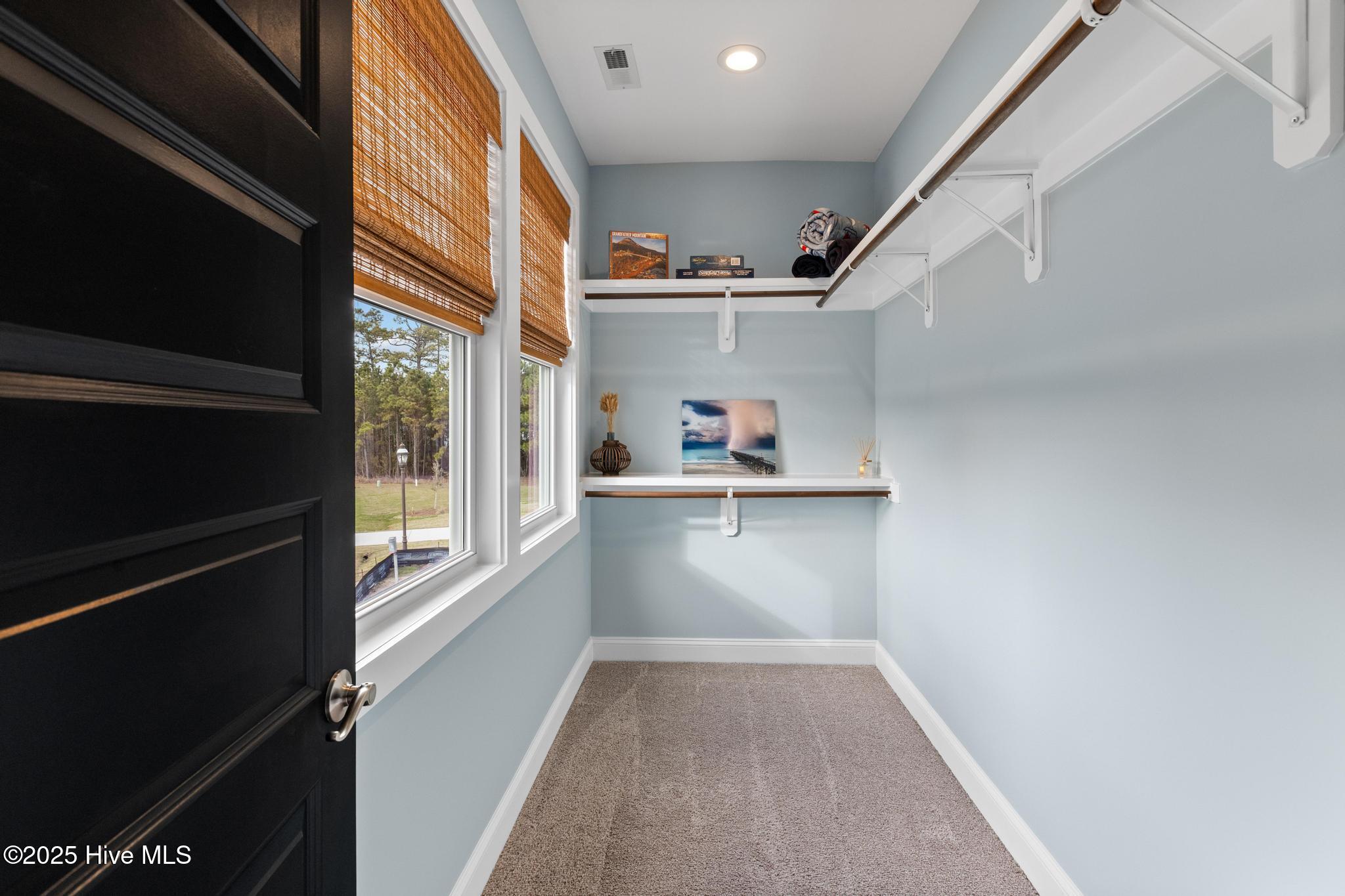817 Sweetgrass Street Holly Ridge, NC 28445 - Photo 25 of 72 UPSTAIRS WALK IN CLOSET OFF FRONT BEDROOM.