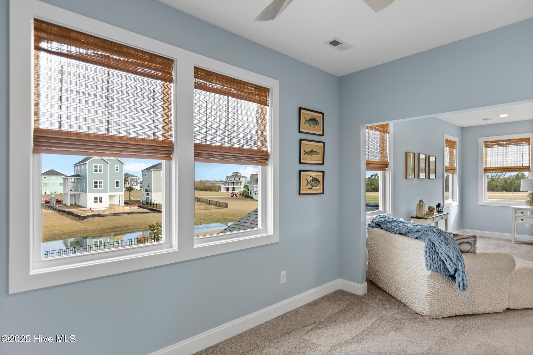 817 Sweetgrass Street Holly Ridge, NC 28445 - Photo 37 of 72 SITTING ROOM. VIEW OF POND.