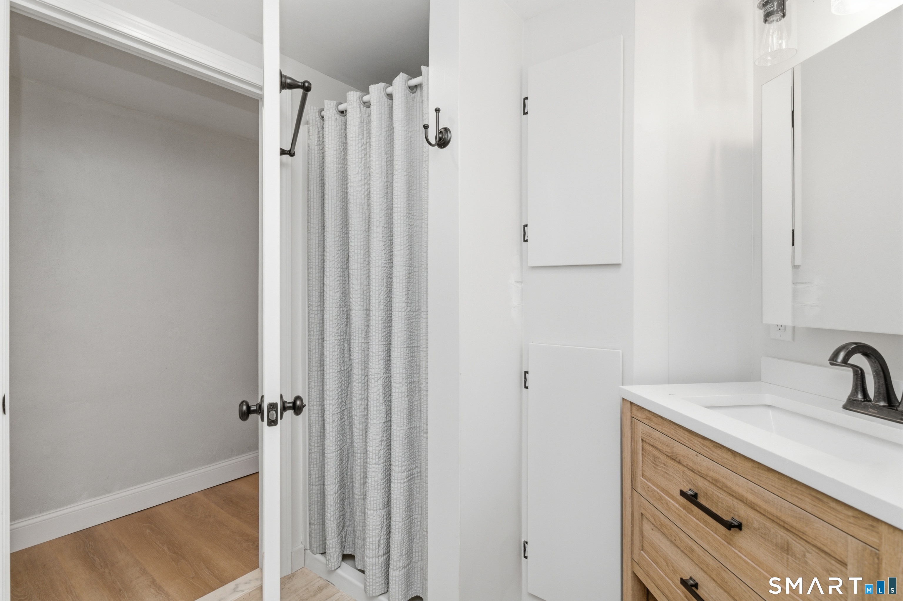 149 Mill Street Wethersfield, CT 06109 - Photo 22 of 29 a bathroom with a sink and vanity