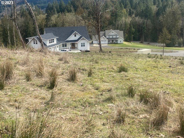 Hawthorne, Unit 10 Scappoose, OR 97056 - Photo 2 of 2 a front view of a house with a yard