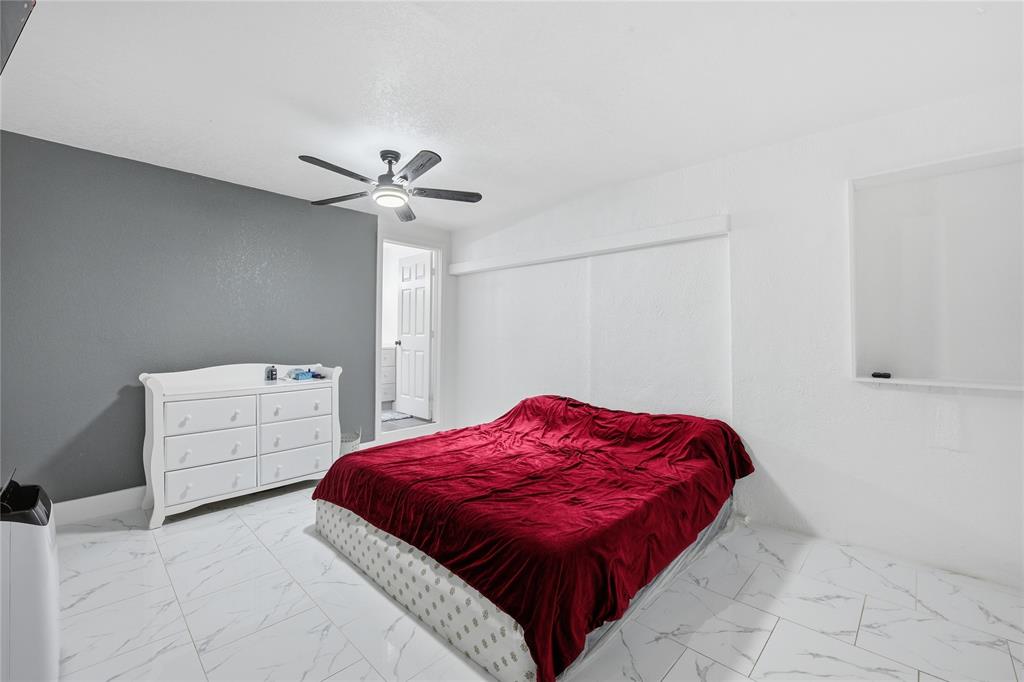 6599 Northwest 1st Street Margate, FL 33063 - Photo 19 of 43 a bedroom with a bed and a closet