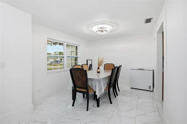 a view of a dining room with furniture