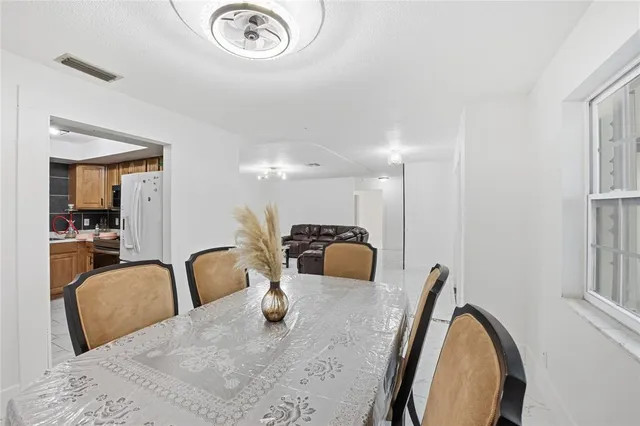 a view of a dining room with furniture