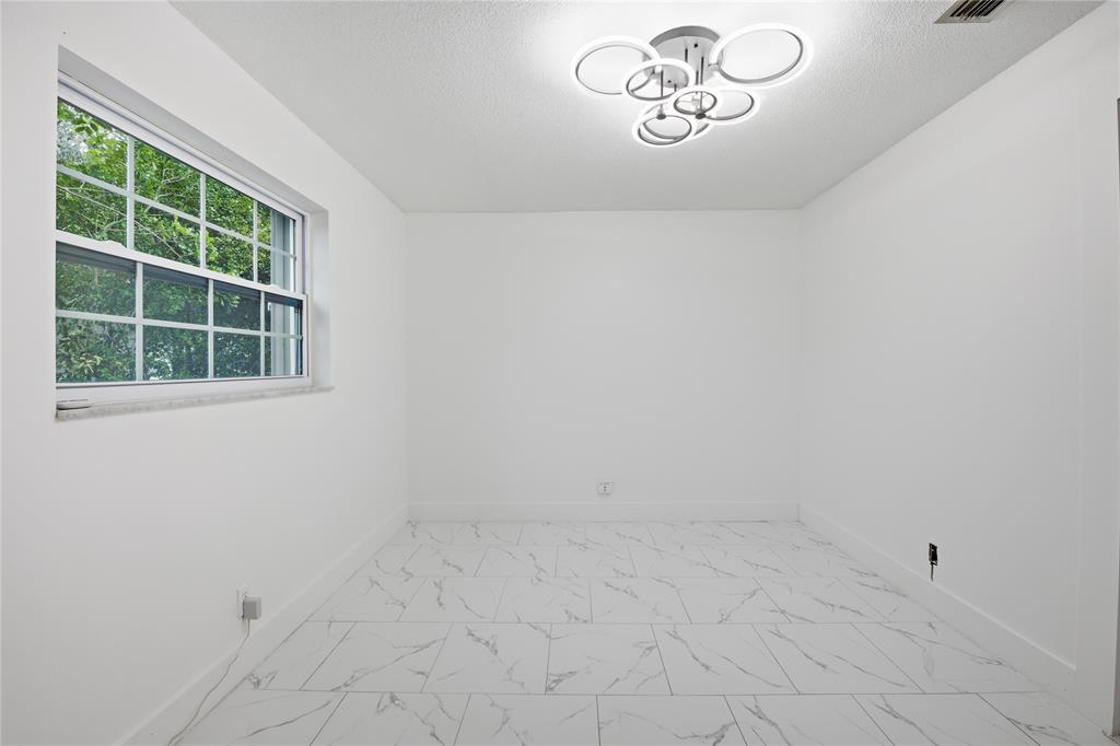 6599 Northwest 1st Street Margate, FL 33063 - Photo 34 of 43 an empty room with a window