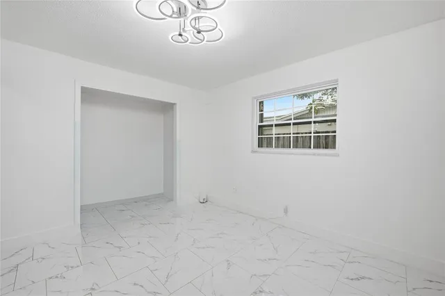 an empty room with a cabinet