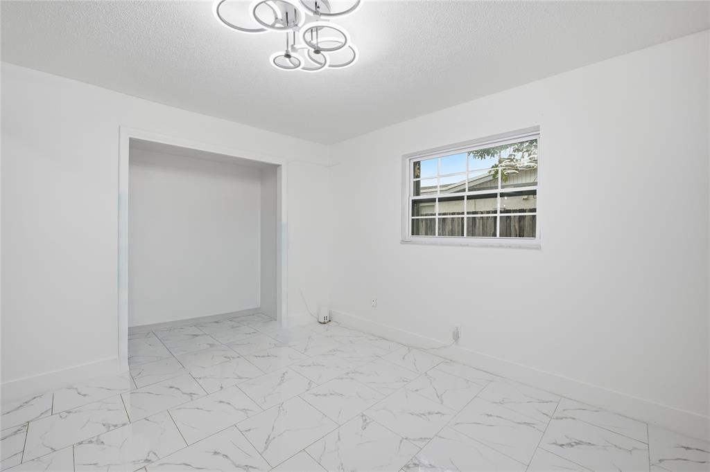 6599 Northwest 1st Street Margate, FL 33063 - Photo 35 of 43 an empty room with a cabinet