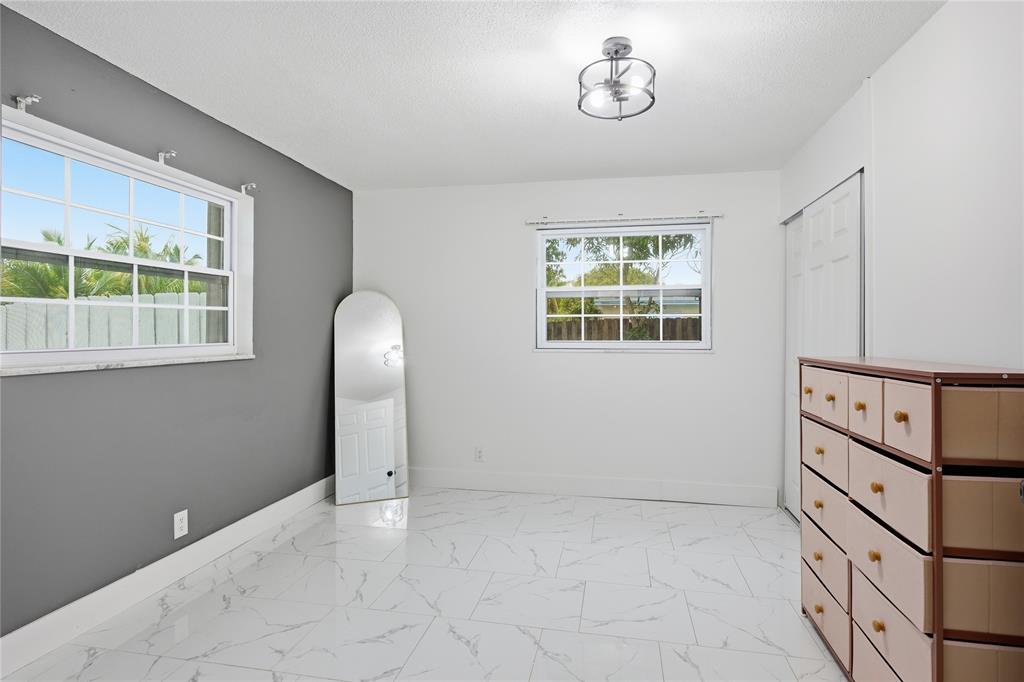 6599 Northwest 1st Street Margate, FL 33063 - Photo 4 of 43 an empty room with windows and closet