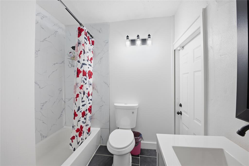 6599 Northwest 1st Street Margate, FL 33063 - Photo 7 of 43 a bathroom with a sink and a toilet