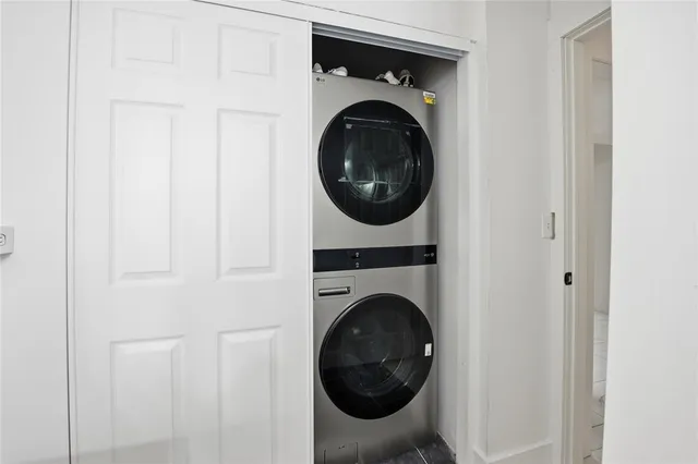 a view of a hallway with washer and dryer