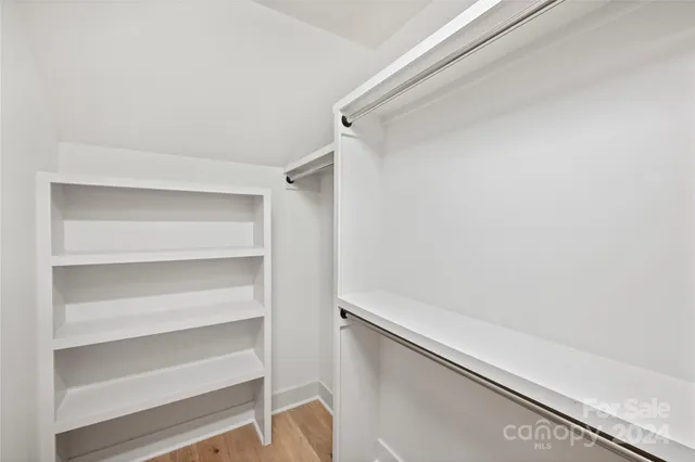 a view of an empty walk in closet