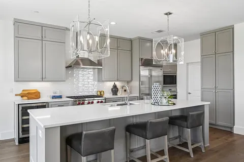 a kitchen with a counter space cabinets and appliances