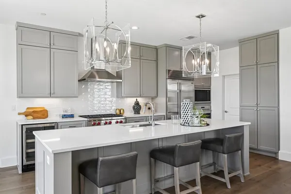 a kitchen with a counter space cabinets and appliances