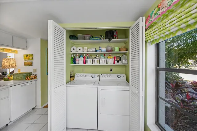 a view of a dining room with furniture wooden floor and chandelier