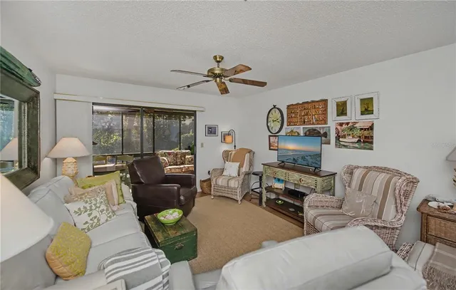 a bedroom with a white bed and white walls
