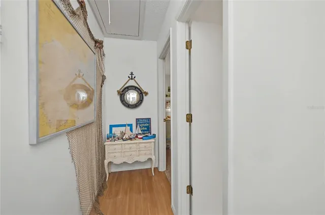 a bedroom with a bed table and window