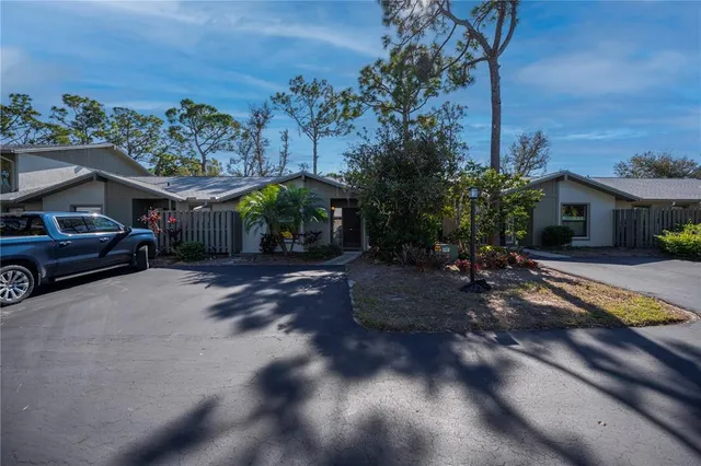 a view of a street with cars parked