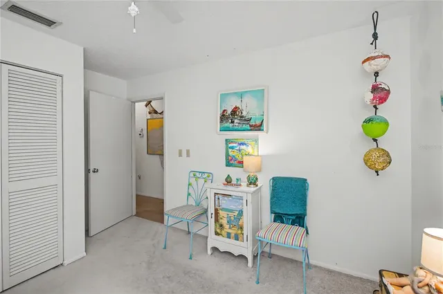 a white toilet sitting next to a bathroom sink and a shower