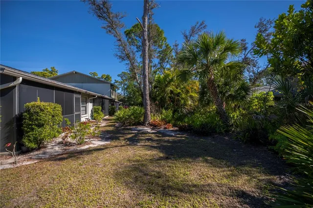 a view of a yard with furniture and a yard