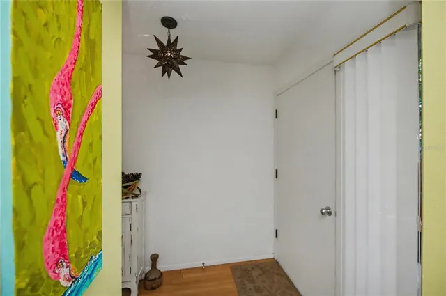a kitchen with white cabinets and appliances