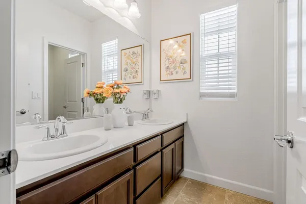 a white toilet sitting next to a bath tub