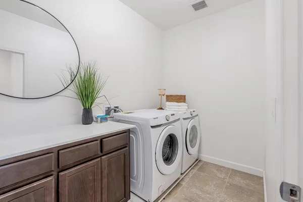 a view of room that has a white walls