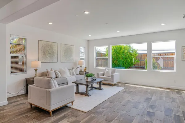 a living room with furniture and a table