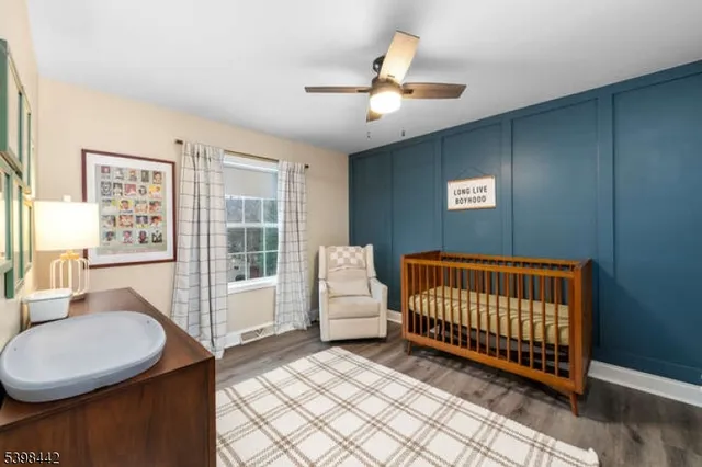 a bedroom with furniture and window