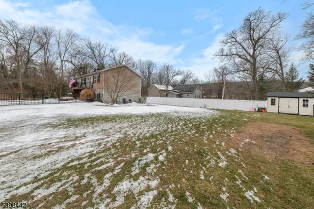 a big yard with road and trees