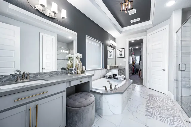 a spacious bathroom with a sink double vanity and a mirror